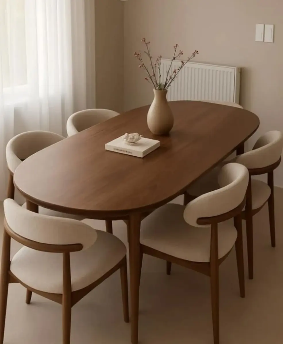 Modern oval dining table and chairs by Kabom Furniture