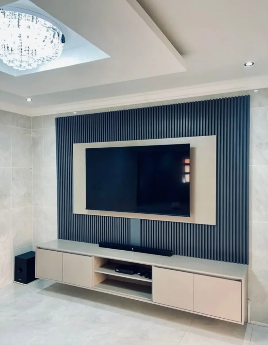 Modern floating TV console and media wall by Kabom Furniture